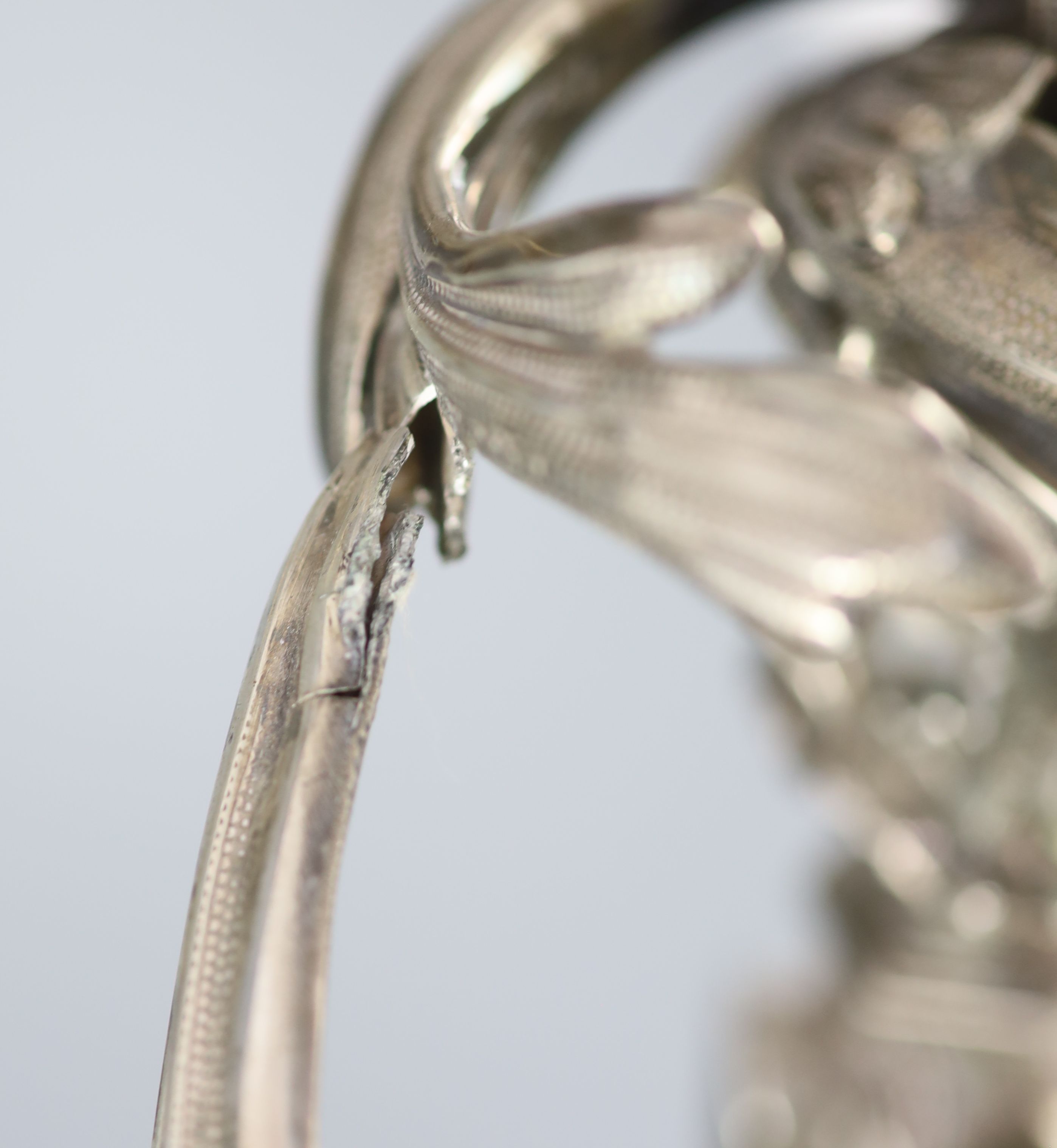 An ornate George III silver three branch, three light candelabrum, by Samuel Roberts, George Cadman & Co (a.f.),